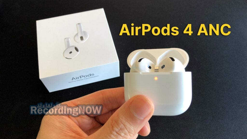 Holding Apple AirPods 4 ANC wireless earbuds in hand