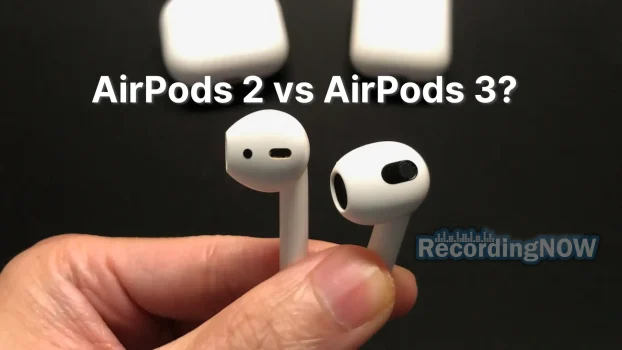 Holding Apple AirPods 2 vs AirPods 3 wireless earbuds in hand