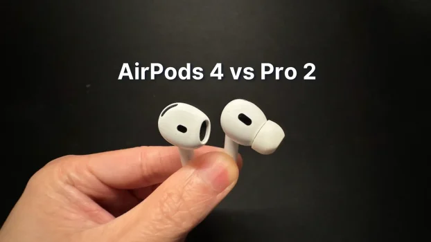 Holding Apple AirPods 4 vs AirPods Pro 2 wireless earbuds in hand