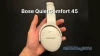 Holding Bose QuietComfort 45 (QC45) headphones earcup in hand