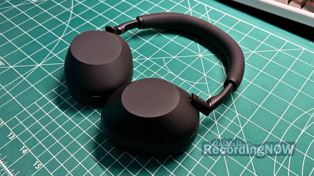 side profile of Sony WH-1000XM6 headphones on desk