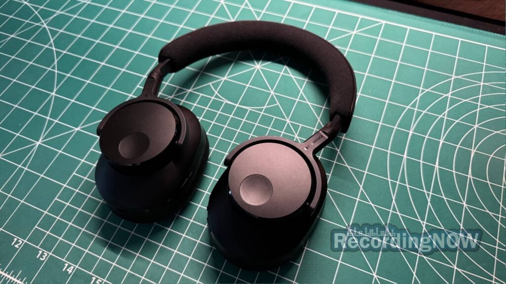 Close up of Cambridge Audio Melomania P100 wireless over-ear noise cancelling headphones on desk