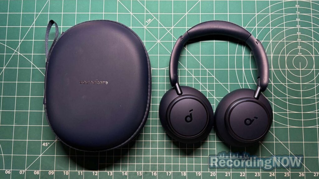 Anker Soundcore Q45 headphones next to included hardshell case