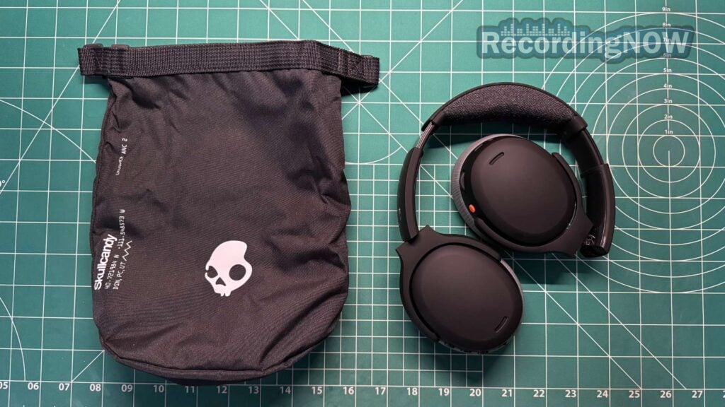 Skullcandy Crusher ANC 2 headphones folded and collapsed next to included soft shell case bag