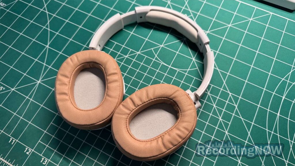 inside earcups of Skullcandy Hesh ANC headphones in white and tan
