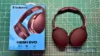 Skullcandy Hesh Evo headphones in black next to original box packaging