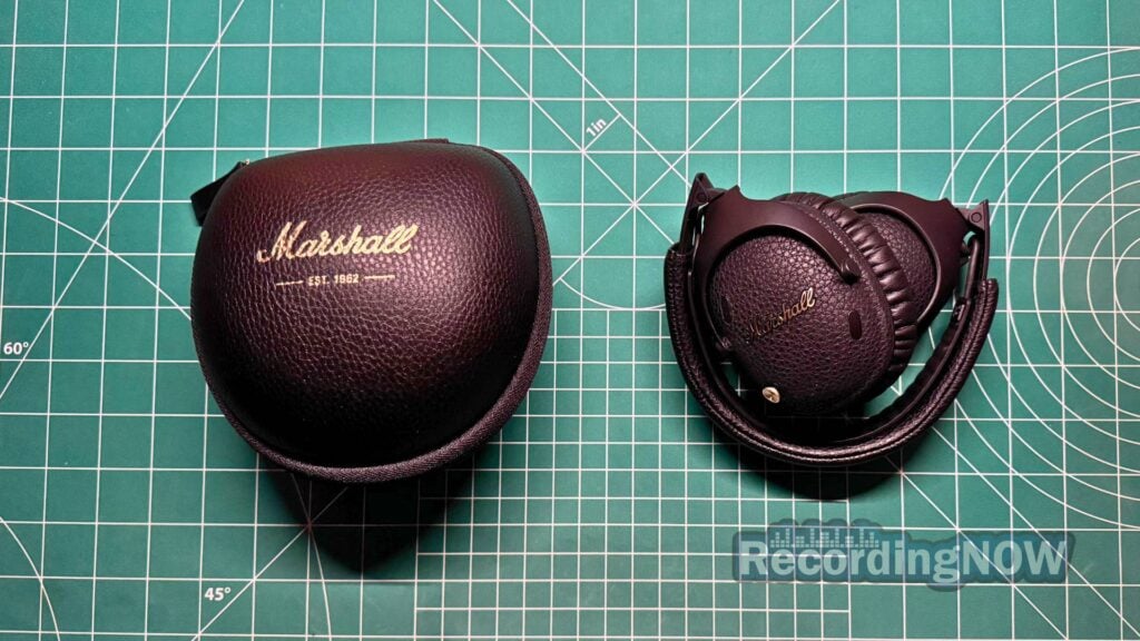 Marshall Monitor III ANC folded and collapsed next to included hardshell case