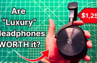 Holding Bang & Olufsen Beoplay H95 headphones in hand