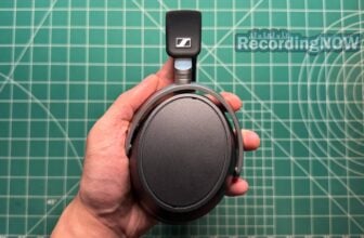 Holding Sennheiser HDB 630 headphones in hand