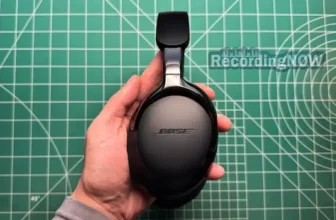 Holding Bose QuietComfort Ultra 2nd gen headphones in hand