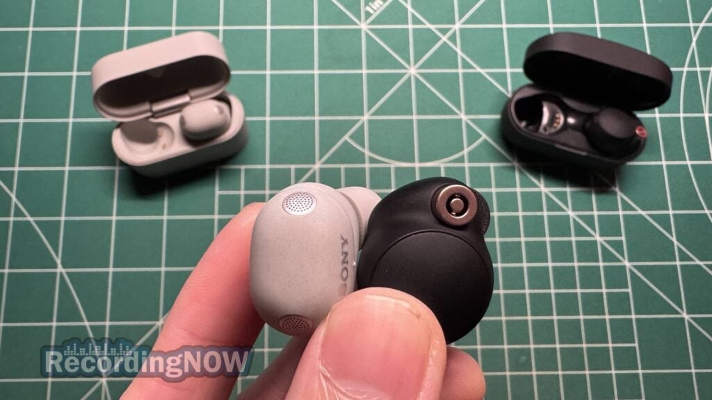 Holding Sony WF-1000XM6 and WF-1000XM4 earbuds in hand