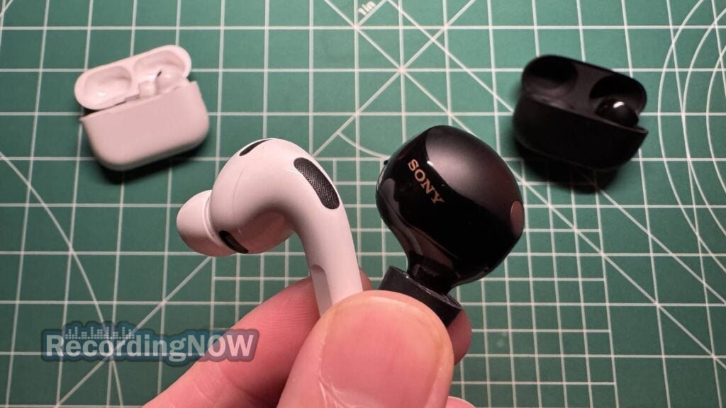 Holding Apple AirPods Pro 3rd Generation and Sony WF-1000XM5 earbuds in hand