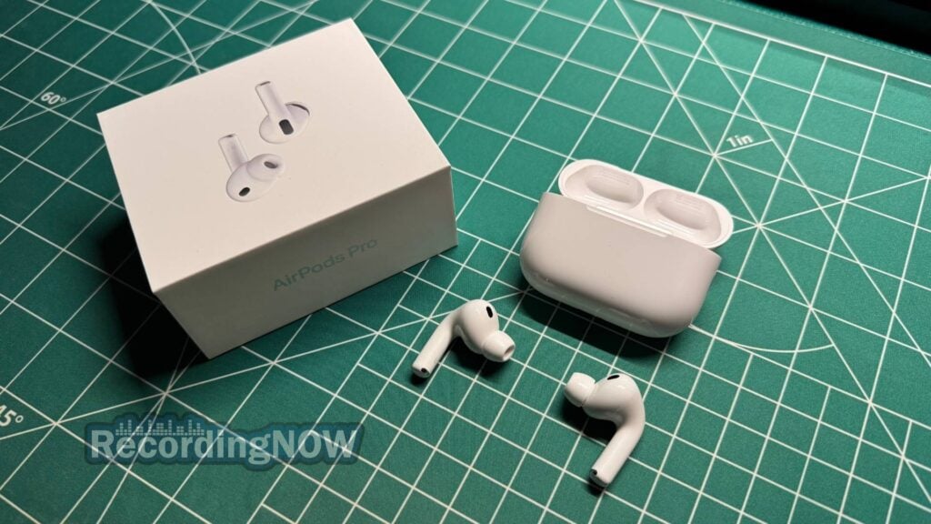 Apple AirPods Pro 3 wireless earbuds next to charging case and original box packaging