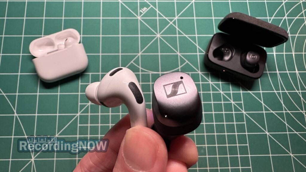 Holding Apple AirPods Pro 3rd Generation and Sennheiser Momentum True Wireless 4 earbuds in hand
