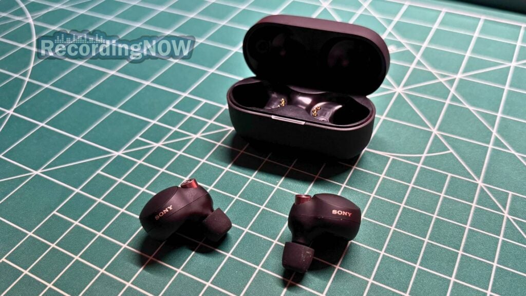 blog-img-1693067280109 Sony WF-1000XM4 wireless noise cancelling earbuds next to charging case