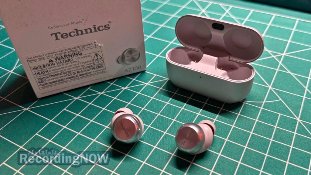 Technics EAH-AZ100 in silver next to charging case and original box packaging