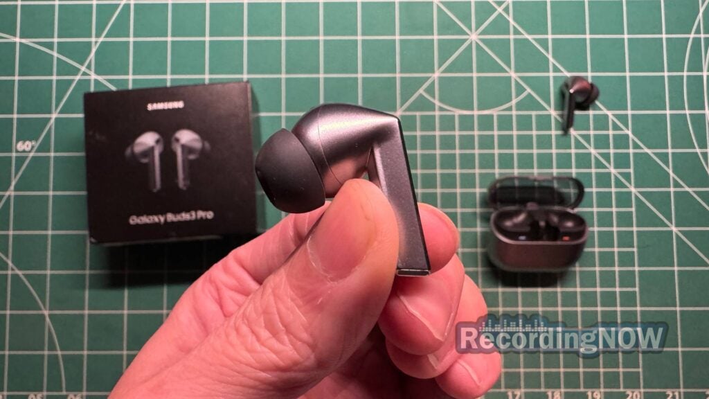 Holding Samsung Galaxy Buds 3 Pro earbud in hand