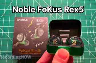 Holding Noble FoKus Rex5 Wireless Earbuds in Green in hand