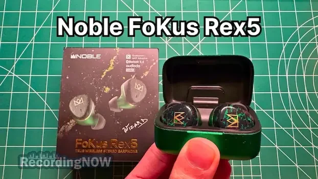 Holding Noble FoKus Rex5 Wireless Earbuds in Green in hand