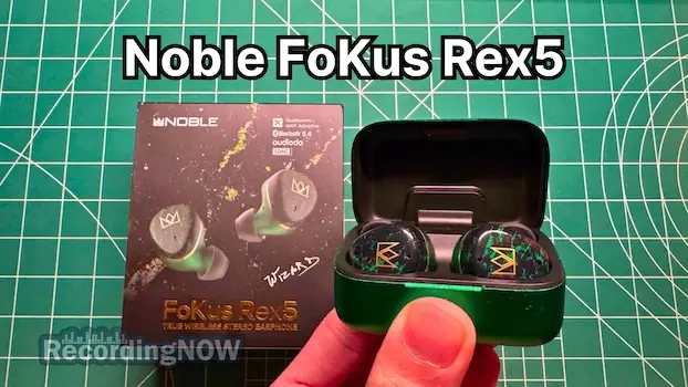 Holding Noble FoKus Rex5 Wireless Earbuds in Green in hand