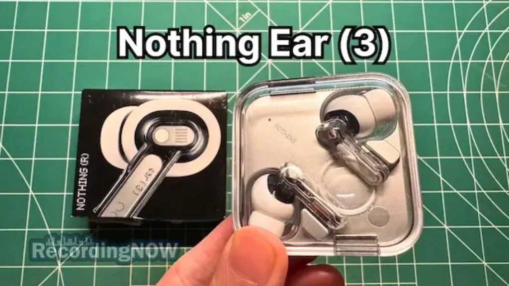 Holding Nothing Ear 3 wireless noise cancelling earbuds in hand