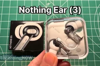Holding Nothing Ear 3 wireless noise cancelling earbuds in hand