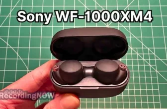 holding Sony WF-1000XM4 wireless noise cancelling earbuds in hand