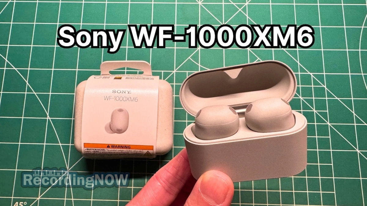 Holding Sony WF-1000XM6 wireless noise cancelling earbuds in hand