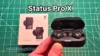 Holding Status Pro X wireless noise cancelling earbuds in hand