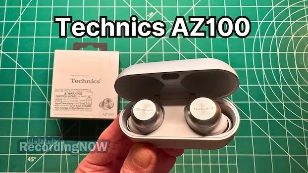 Holding Technics EAH-AZ100 wireless noise cancelling earbuds in hand