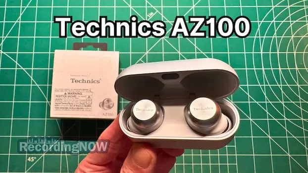 Holding Technics EAH-AZ100 wireless noise cancelling earbuds in hand