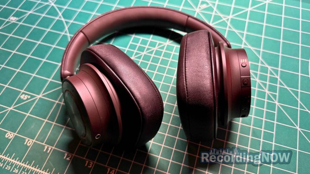 side profile of Dali IO-12 earcups and close up of buttons and controls