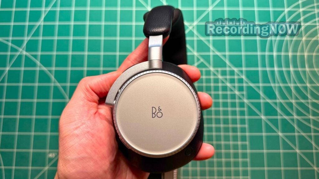 blog-img-1708892563107 Holding Bang & Olufsen Beoplay H100 headphones in Infinite Black colorway in hand