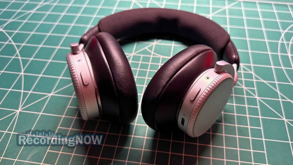 Side profile of B&O Beoplay H100 earcups and close up of buttons and controls