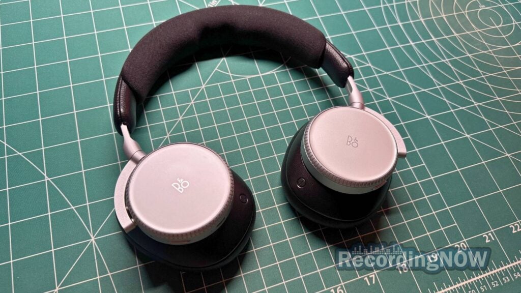 Bang & Olufsen Beoplay H100 headphones in Infinite Black and silver color on desk