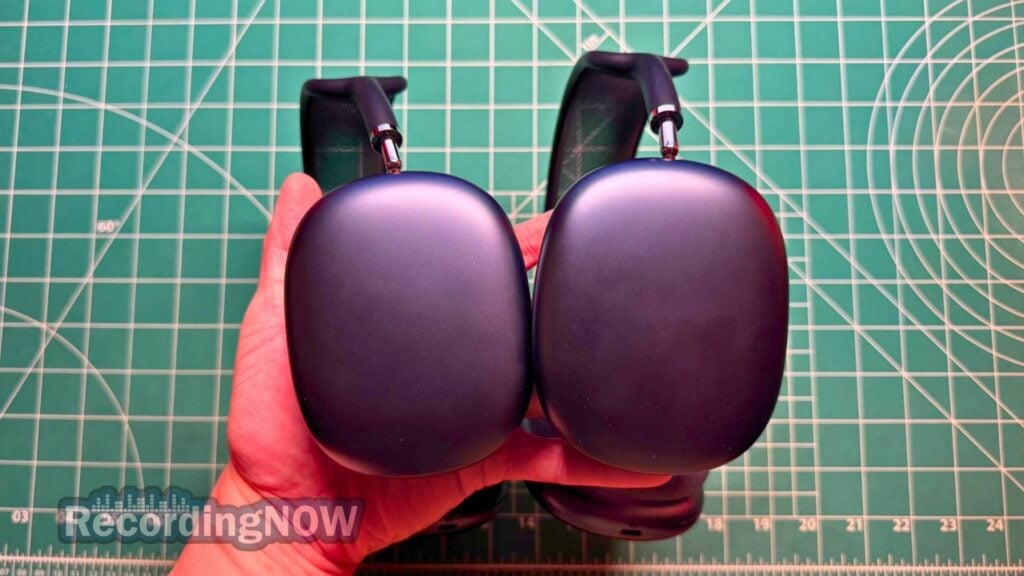 Holding AirPods Max vs AirPods Max 2 headphones in hand