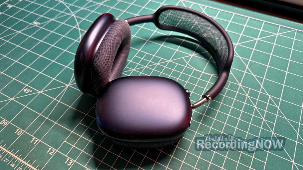 Close up of Apple AirPods Max 2 aluminum earcups and stainless steel hinge