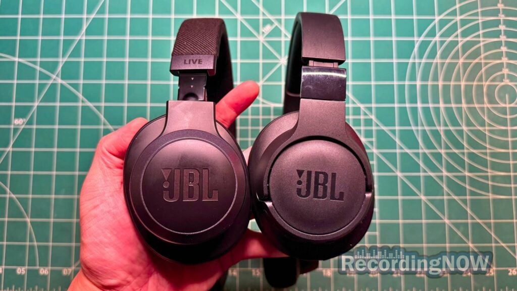 Holding JBL Live 770NC and JBL Tune 770NC headphones in hand