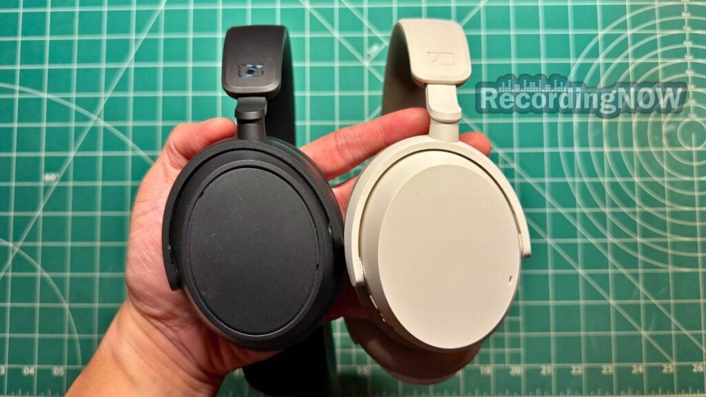 Holding Sennheiser Accentum Plus and Accentum headphones in hand