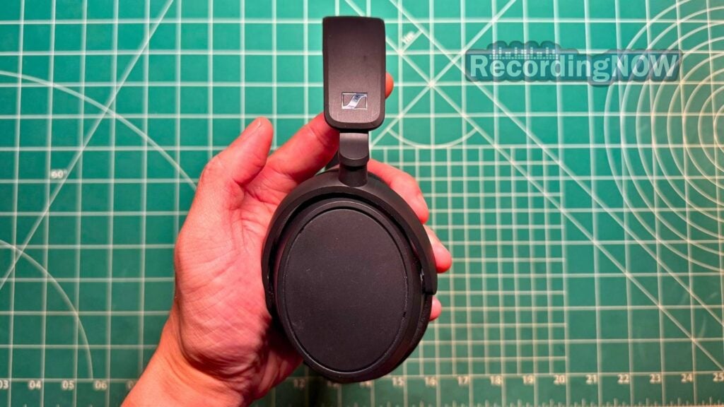 blog-img-1693067280109 Holding Sennheiser Accentum Plus headphones in hand
