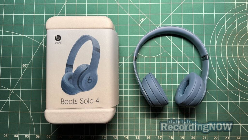 Beats Solo 4 in blue next to original box packaging