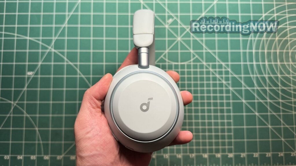 Holding Earcup of Anker Soundcore Space 2 headphones in hand