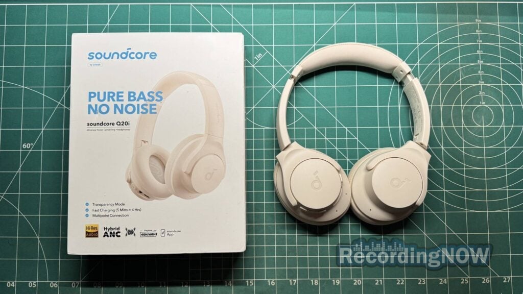 Anker Soundcore Q20i wireless headphones next to original box packaging