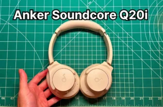 Holding Anker Soundcore Q20i wireless noise cancelling headphones in hand