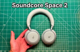 Holding Anker Soundcore Space 2 headphones in Seafoam Green in hand