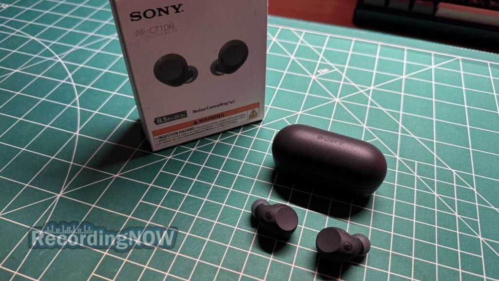 Sony WF-C710N earbuds and charging case next to box