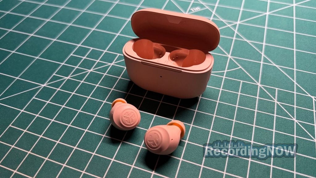JLab Go Air Pop+ earbuds next to charging case