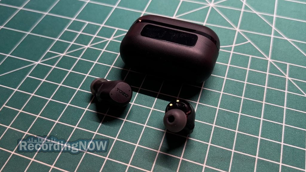 TOZO NC9 earbuds next to charging case