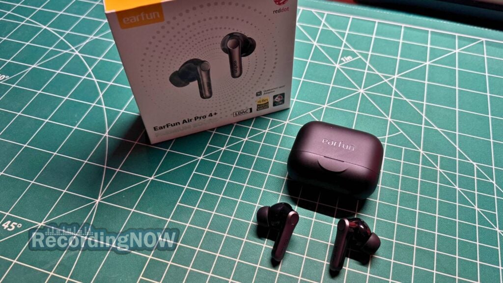 EarFun Air Pro 4 Plus earbuds next to charging case and box