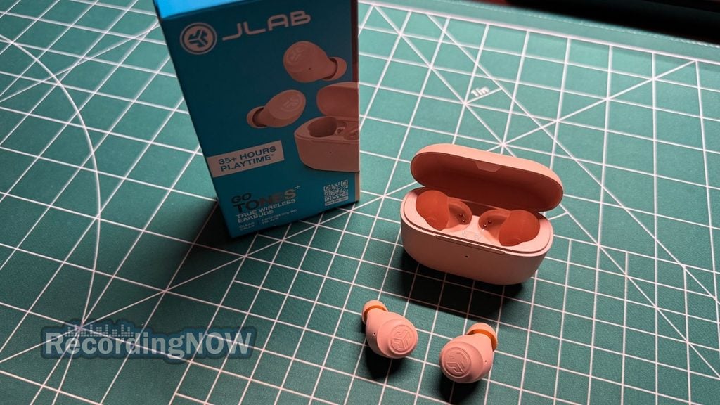 JLab Go Air Pop+ earbuds and charging case next to box